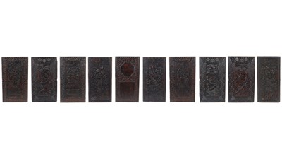 Lot 1368 - A collection of 10 Chinese oriental ebonised hard wood carved panels