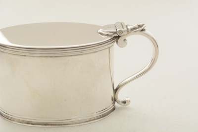 Lot 53 - A matched pair of George III silver mustard pots