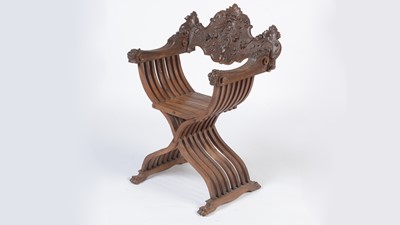 Lot 1386 - A decorative Italian carved walnut Savonarola chair c1900