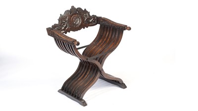 Lot 1388 - A 17th Century style Italian carved walnut Savonarola chair