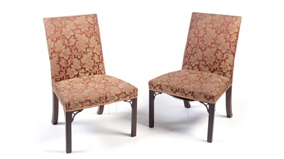 Lot 1389 - A pair of Georgian mahogany hall chairs in the Chippendale style