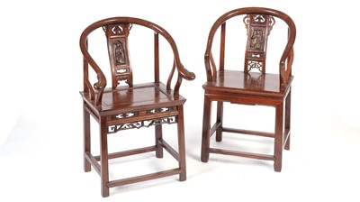 Lot 1393 - Two Chinese hardwood horseshoe chairs