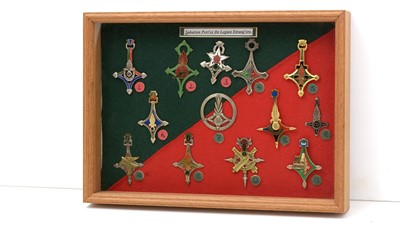 Lot 1039 - A collection of Foreign Legion insigne badges