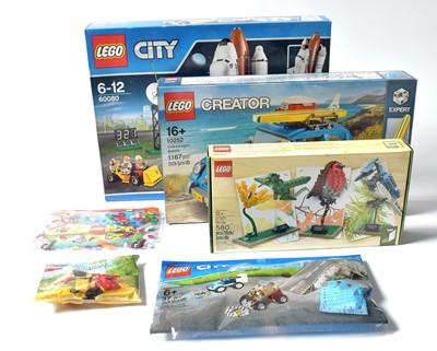 Lot 279 - A collection of LEGO City and LEGO Creator sets, and another.