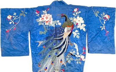 Lot 1144 - A Japanese Showa Era petrol blue silk botan ni kujaku kimono