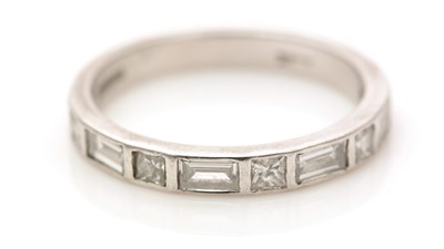 Lot 497 - A diamond half hoop eternity ring