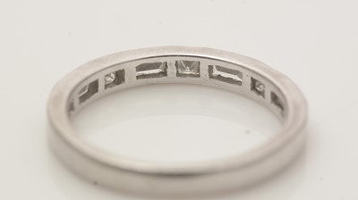 Lot 497 - A diamond half hoop eternity ring