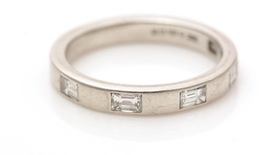 Lot 507 - A baguette-cut diamond ring