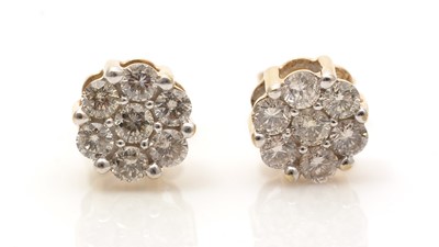 Lot 740 - A pair of diamond cluster earrings