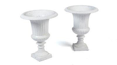 Lot 1325 - A pair of French cast iron classical style garden urns painted in a white colourway