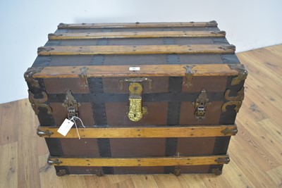 Lot 85 - A vintage oak, brass and metal-bound cabin trunk