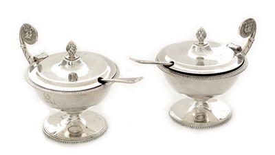 Lot 111 - A pair of George V silver mustard pots and matching spoons