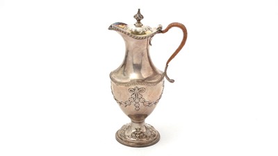 Lot 189 - A George III silver hot water jug