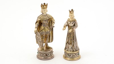 Lot 228 - A pair of early 20th Century continental silver and parcel-gilt figures