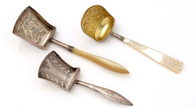 Lot 382 - A George III silver caddy spoon; and two others