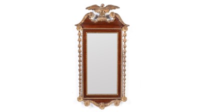 Lot 918 - An American mahogany and gilt gesso parcel gilt wall mirror