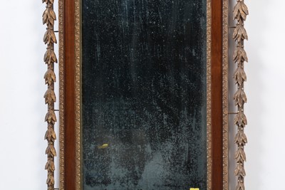 Lot 1307 - An American mahogany and gilt gesso parcel gilt wall mirror