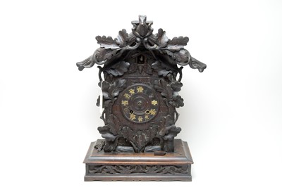 Lot 278 - An American ebonised wood cuckoo wall clock