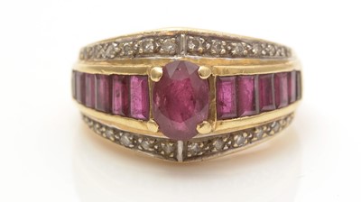 Lot 695 - A ruby and diamond dress ring
