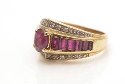 Lot 695 - A ruby and diamond dress ring