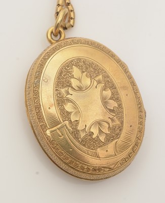 Lot 690 - A Victorian gold locket on chain