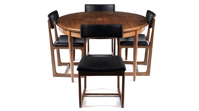 Lot 35 - A retro teak extending dining table and four chairs