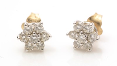 Lot 601 - A pair of diamond cluster earrings