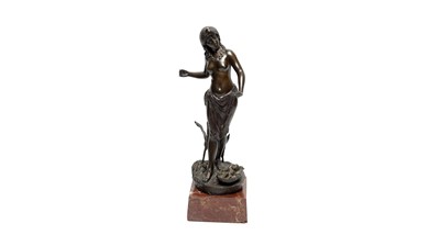 Lot 1283 - Artist unknown, a brown patinated bronze sculpture, Phaeroh's daughter coming across the child Moses