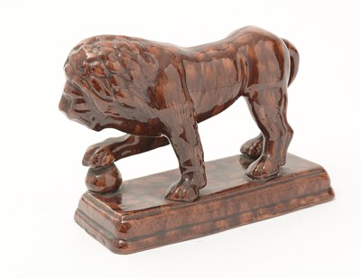 Lot 742 - A 19th Century Staffordshire treacle glazed Medici lion