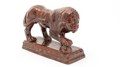 Lot 742 - A 19th Century Staffordshire treacle glazed Medici lion