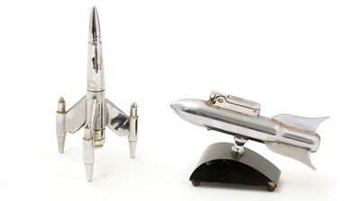 Lot 718 - Two mid-20th Century chrome rocket pattern table lighters
