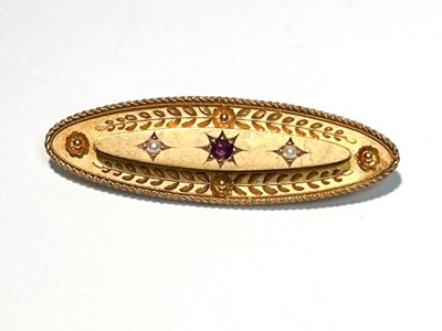 Lot 120 - A Victorian 15ct yellow gold, ruby and seed pearl brooch