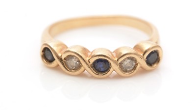 Lot 620 - A sapphire and diamond ring