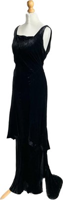 Lot 1146 - A 1920s black velvet bias cut evening dress