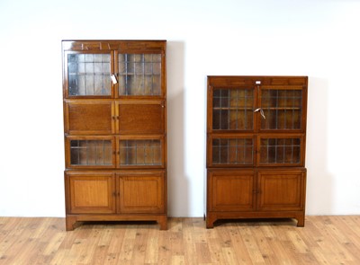 Lot 22 - Two fiddleback mahogany Globe Wernicke style sectional bookcases c.1920's