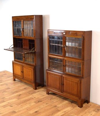 Lot 22 - Two fiddleback mahogany Globe Wernicke style sectional bookcases c.1920's