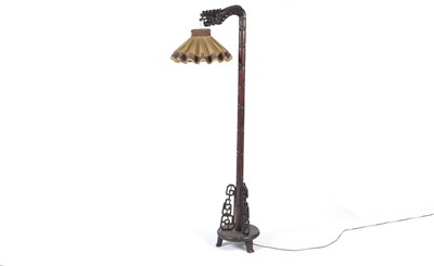 Lot 1292 - A 20th Century Chinese Oriental carved hardwood standard lamp.