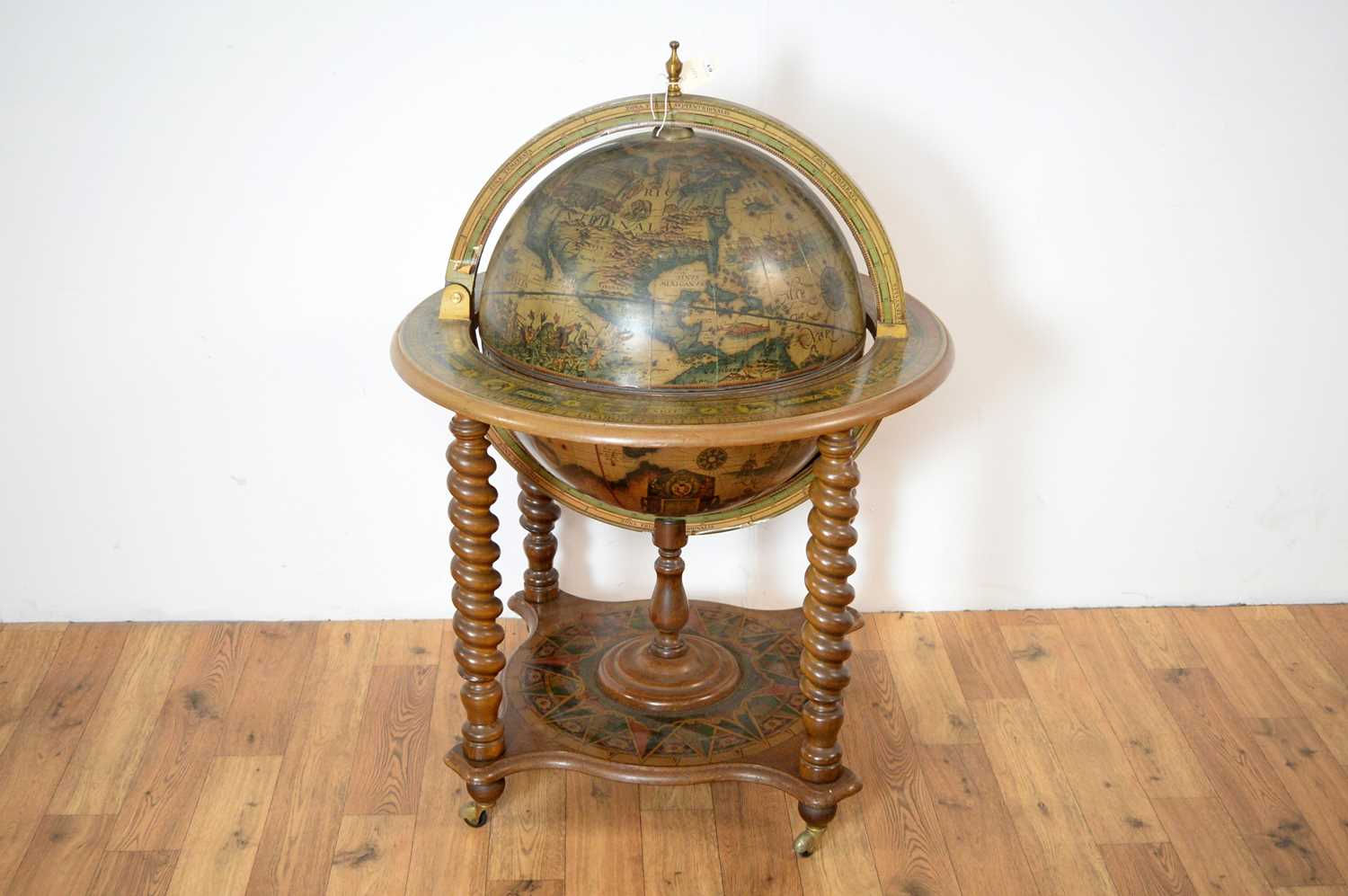 Lot 61 - A reproduction globe drinks trolley