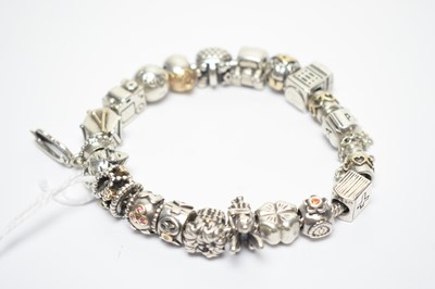 Lot 148 - A silver Pandora charm bracelet, boxed.