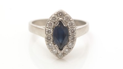 Lot 642 - A sapphire and diamond cluster ring