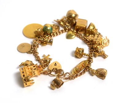 Lot 119 - A 9ct gold bracelet set with a selection of gold and other charms