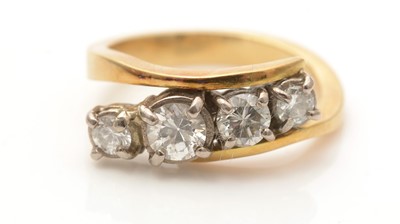 Lot 633 - A four stone diamond ring