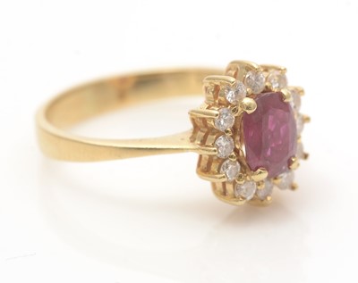 Lot 635 - A ruby and diamond cluster ring