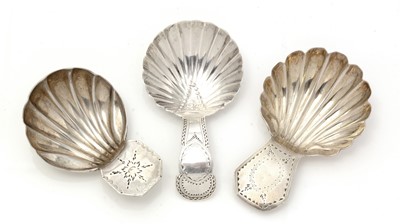 Lot 233 - A George III silver caddy spoon; and two others