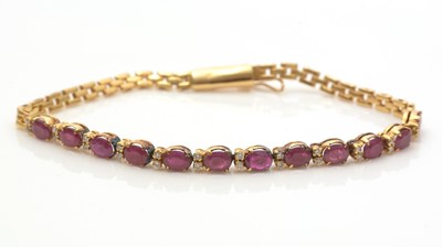 Lot 752 - A ruby, diamond and gold bracelet
