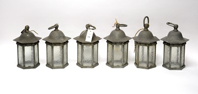 Lot 230 - A set of six pewter lanterns with associated wall supports