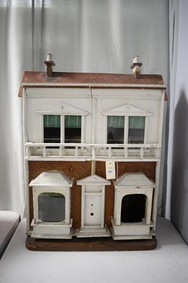 Lot 443 - A vintage two storey dolls house