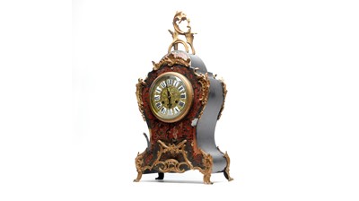 Lot 1242 - An ornate 19th Century French red Boulle bracket clock