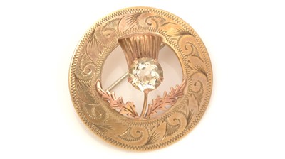 Lot 761 - A 9ct yellow gold and citrine Scottish thistle pattern brooch