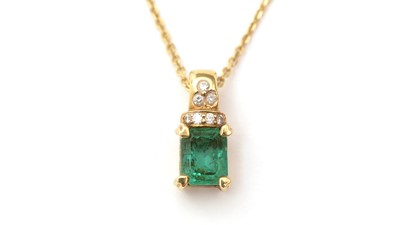 Lot 166 - An emerald and diamond pendant on chain